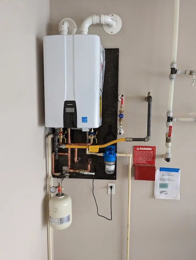 Professional plumber installing copper piping in a Lochmoor Waterway Estates home